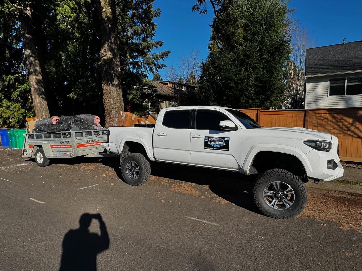 All Kine Junk Removal branded truck and trailer ready for hauling